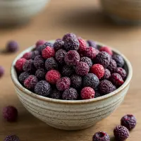 A colorful mix of dried berries for wholesale, including cranberries and blueberries.