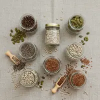 A variety of healthy edible seeds, including chia, flax, and pumpkin seeds for distribution.